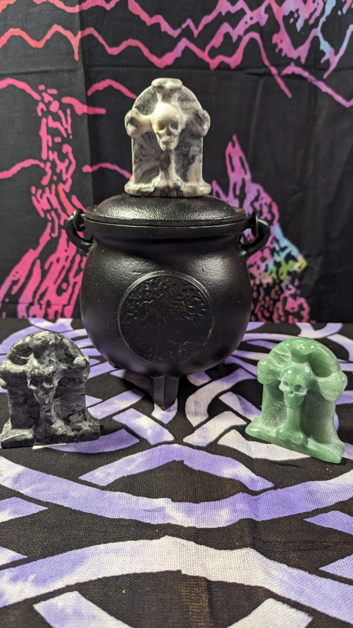 A black pot sitting on top of a table.