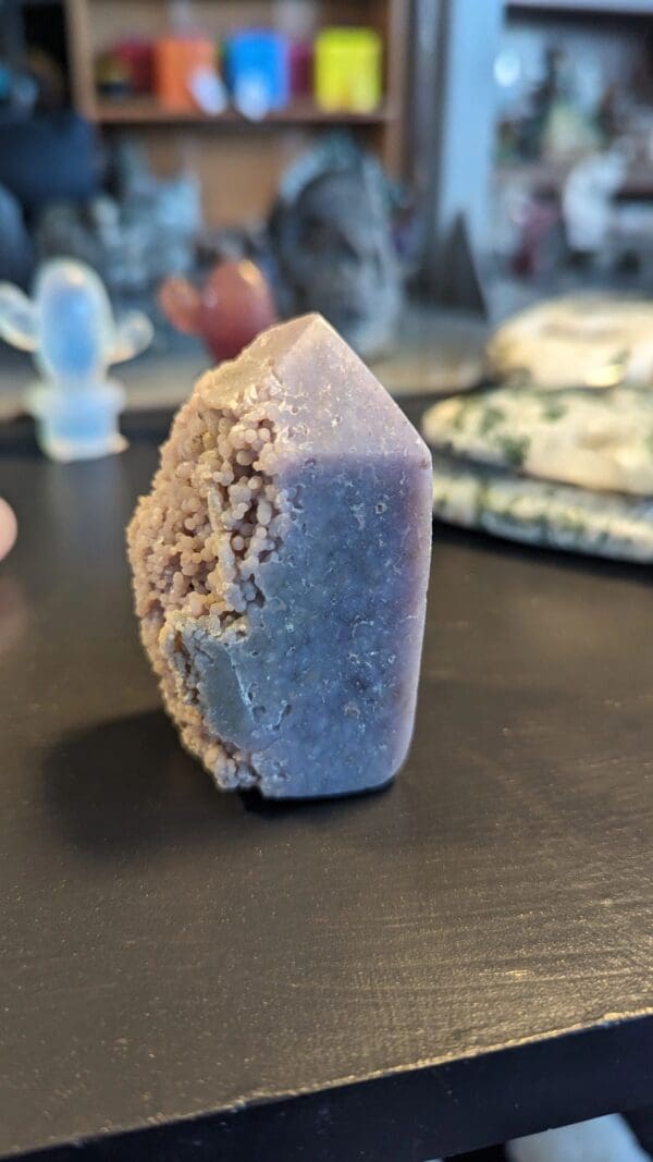 A blue soap sitting on top of a wooden table.