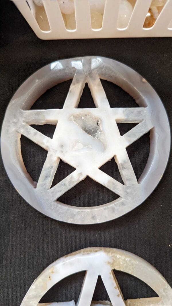 A white pentacle is shown on the wall.