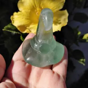 A person holding an empty condom in their hand.