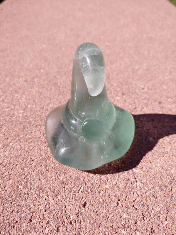 A close up of an empty condom on the ground