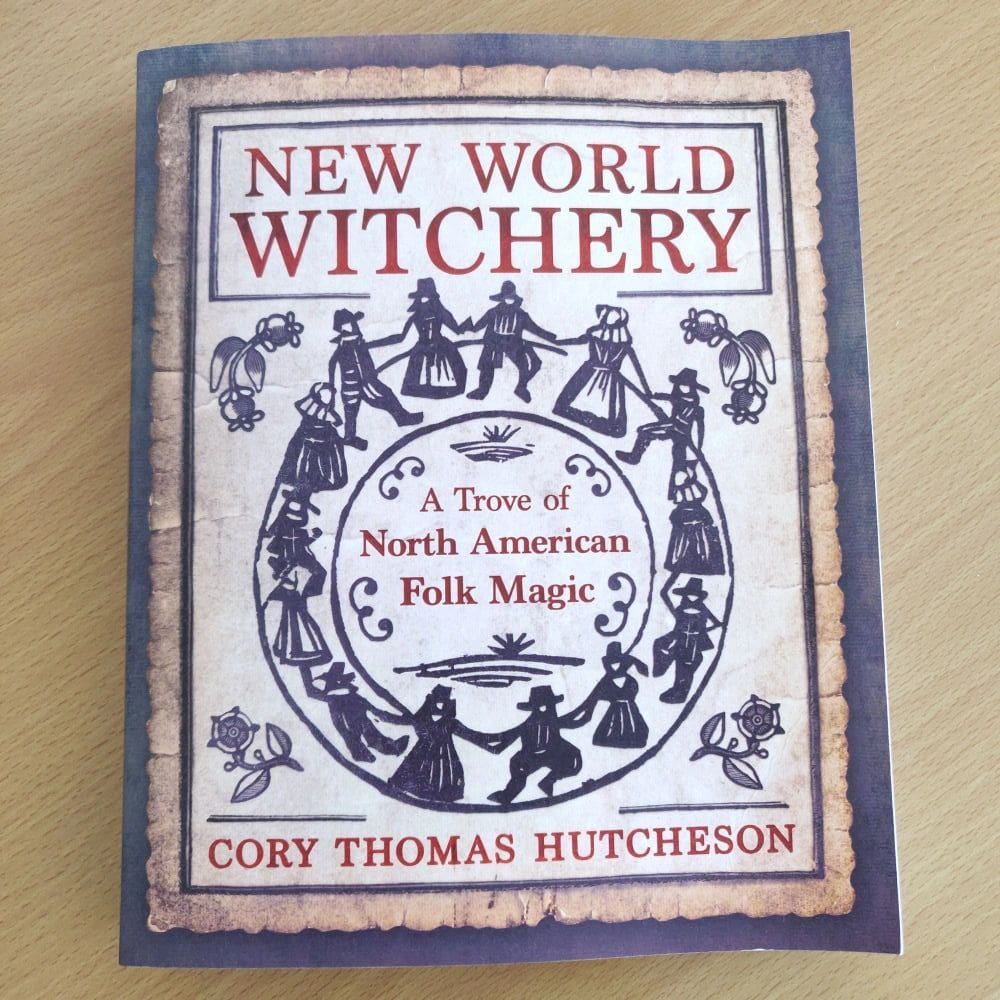 A book about witchcraft is sitting on the table.