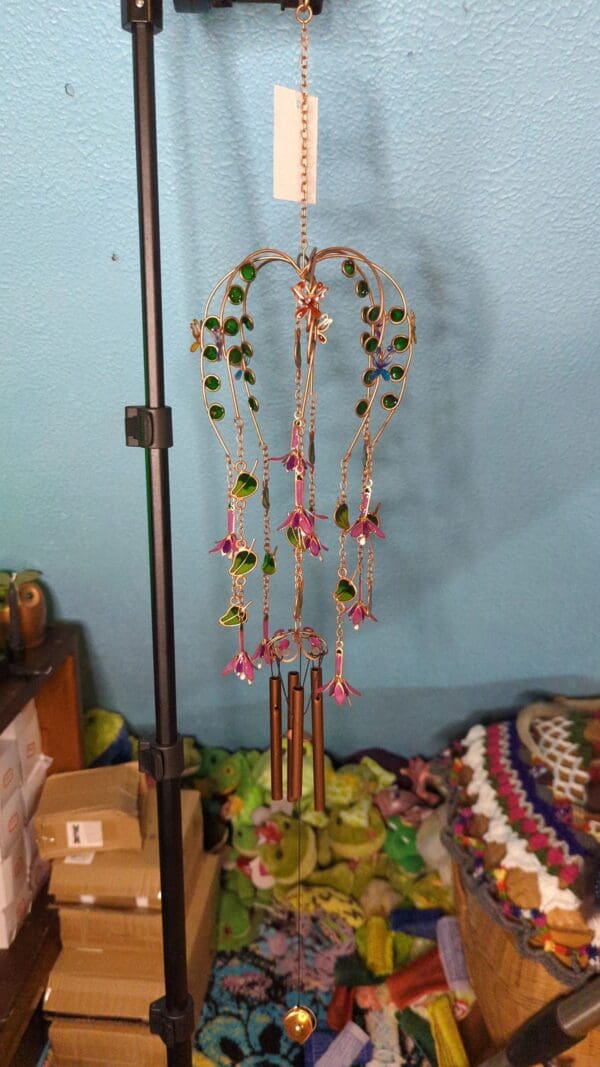 A large metal stand with many different colored beads hanging from it.