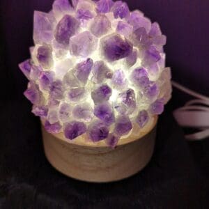 A purple lamp with a bunch of purple rocks