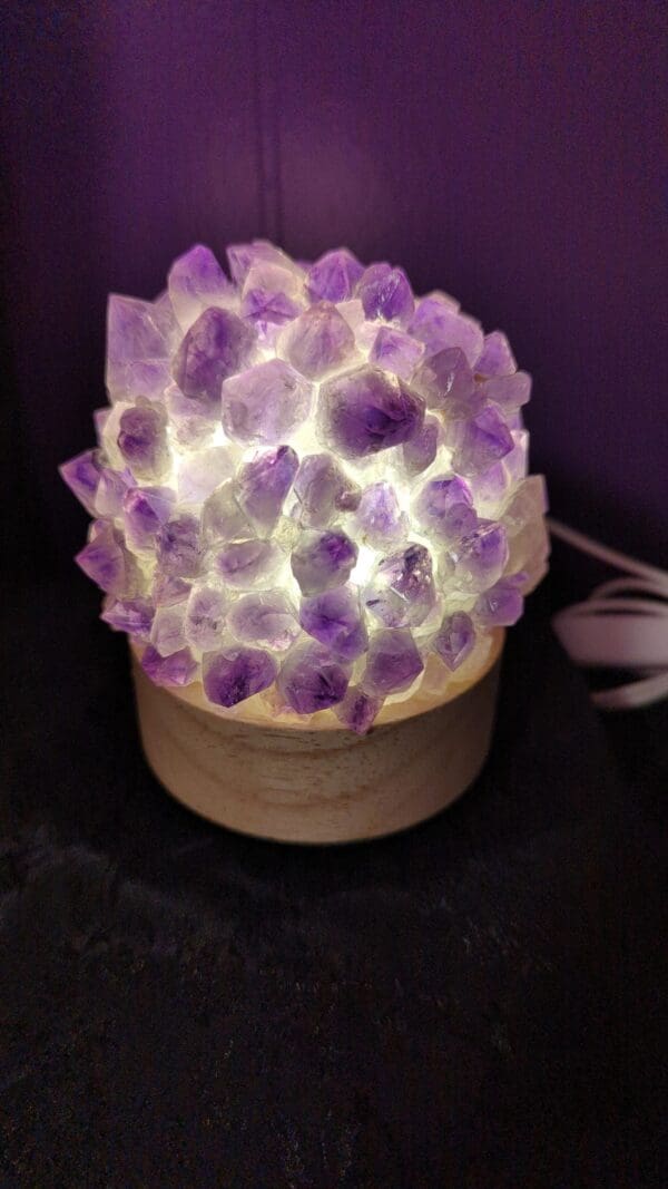 A purple lamp with a bunch of purple rocks