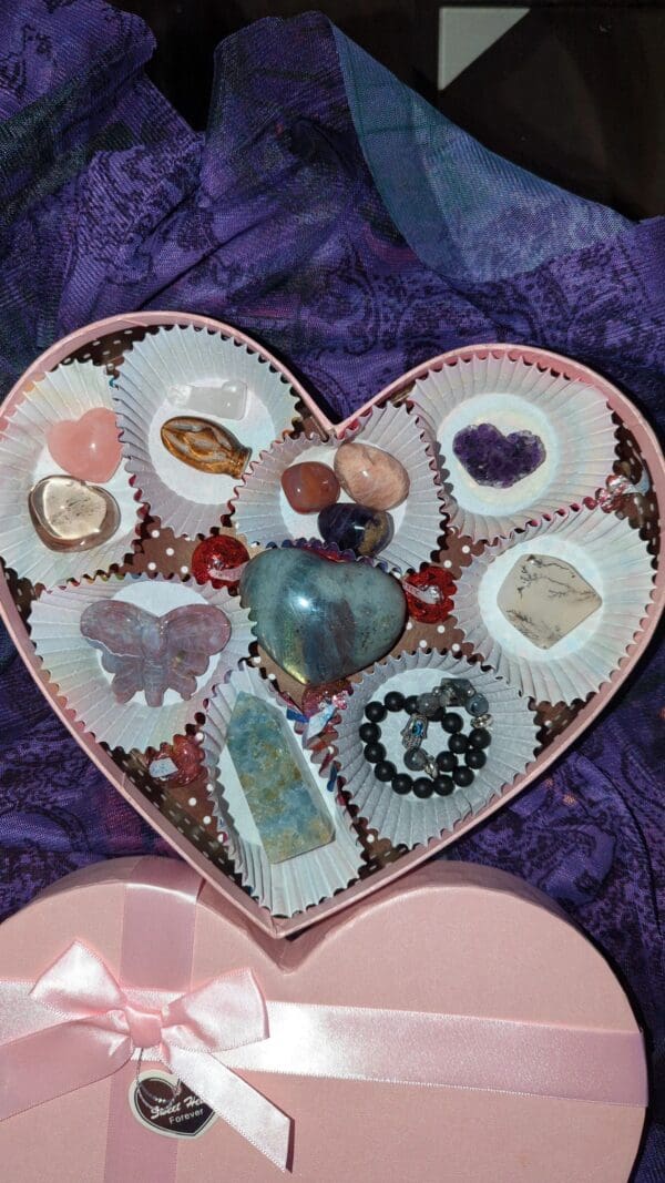 A heart shaped tray filled with various items.