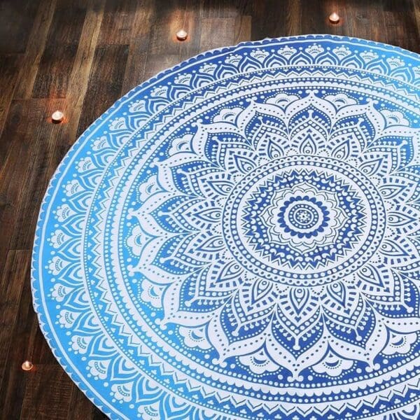 A round blue and white mandala on the ground.