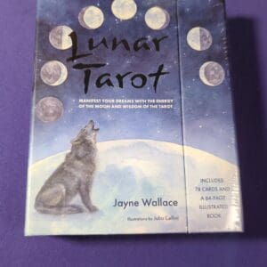 A book about tarot is sitting on the table.