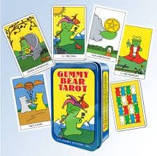 A tin of gummy bear tarot cards with six different images.