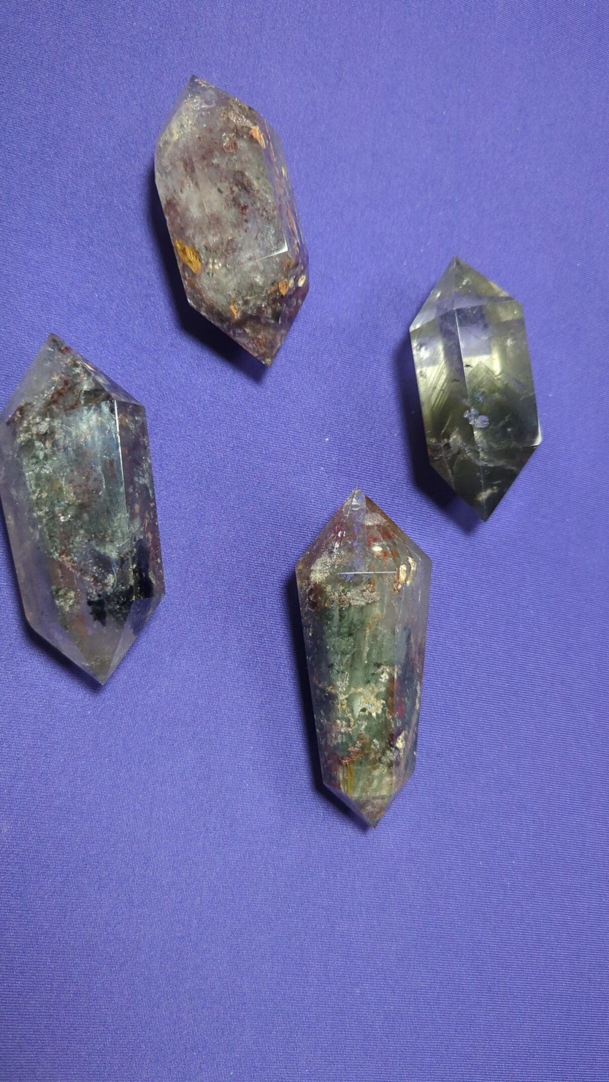 A close up of four pieces of crystal