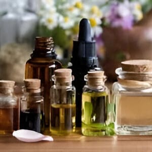 A table topped with bottles of different oils.