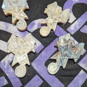 A group of four white stars and a purple star.