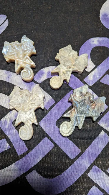 A group of four white stars and a purple star.